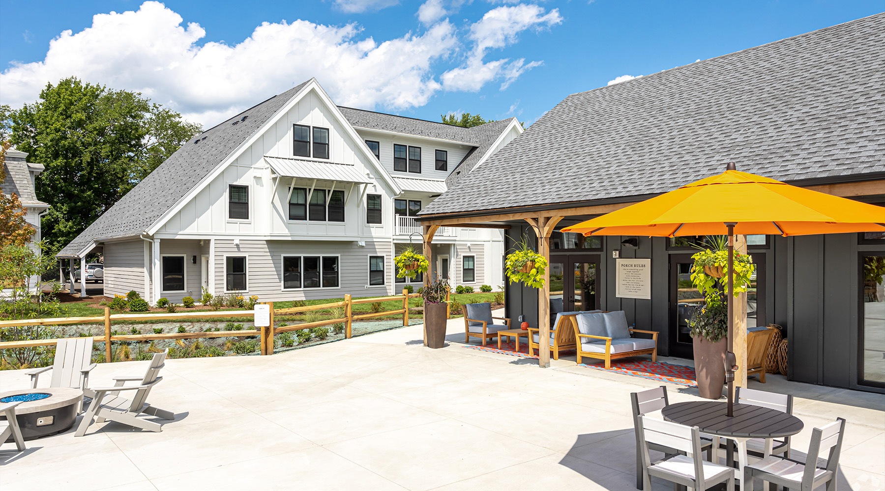 Find your perfect fit at Oriole Landing a patio with an umbrella and a table with chairs