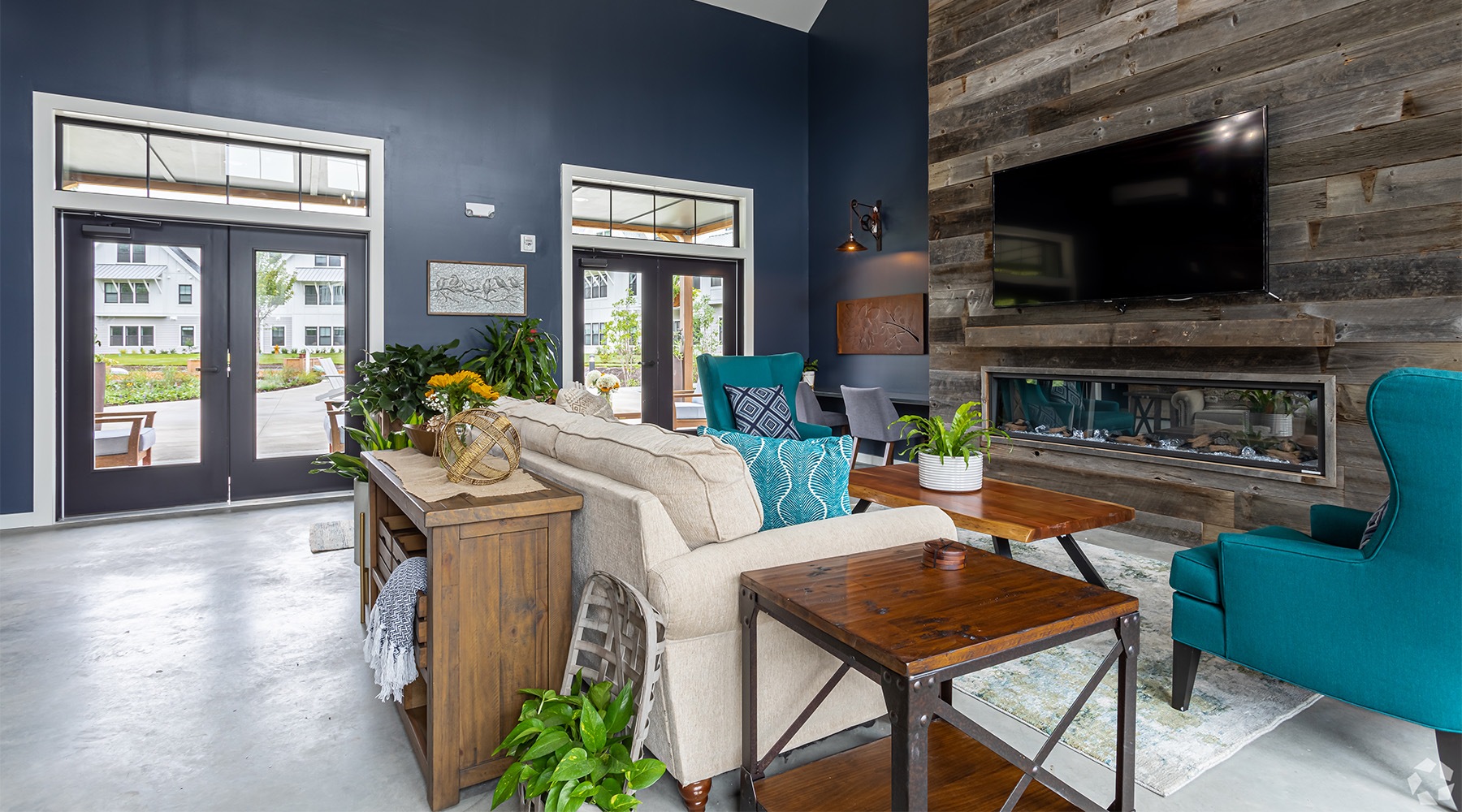Close to the center of everything a lobby with a couch and a tv