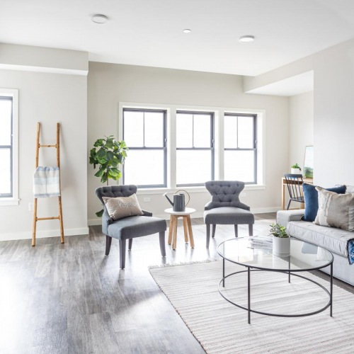 All the comforts of luxury living a living room with a couch tv and a table